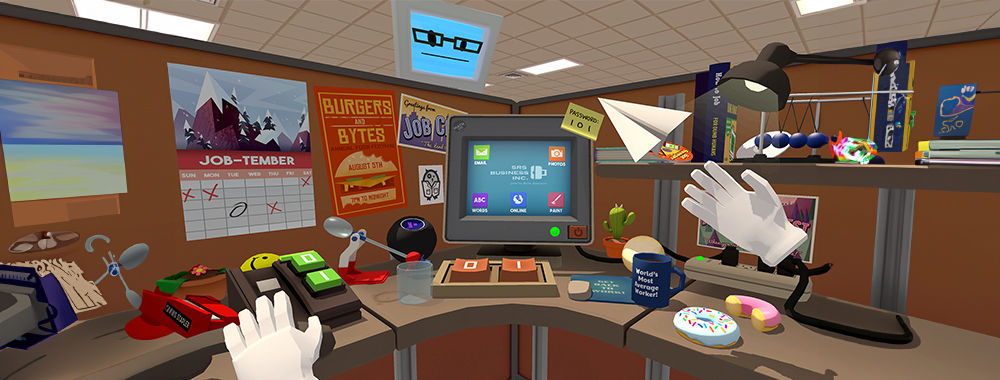 A screenshot from the VR game, Job Simulator. It's from the perspective of the player, in an office cubicle. In the office cubicle is a desk, a computer, phone, posters a mug and other office objects. Two hands are interacting with the virtual environment