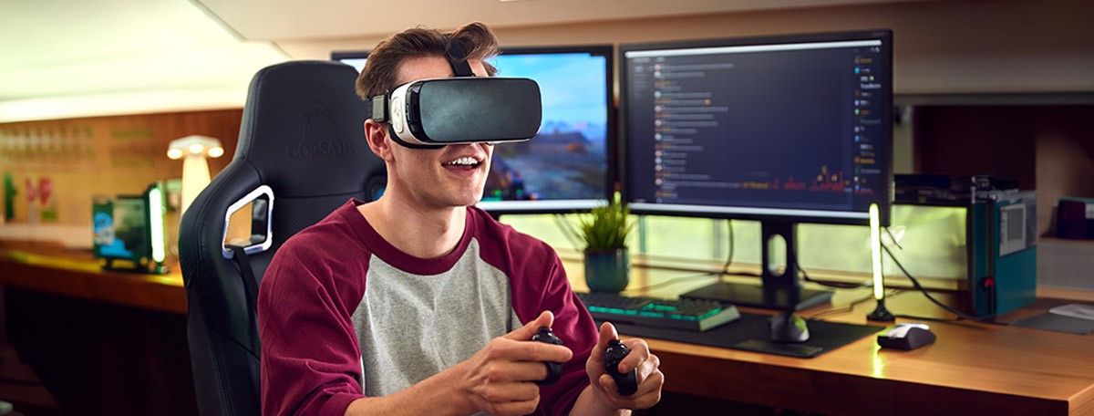 Man wearing VR headset and interacting in the virtual reality with hand controllers