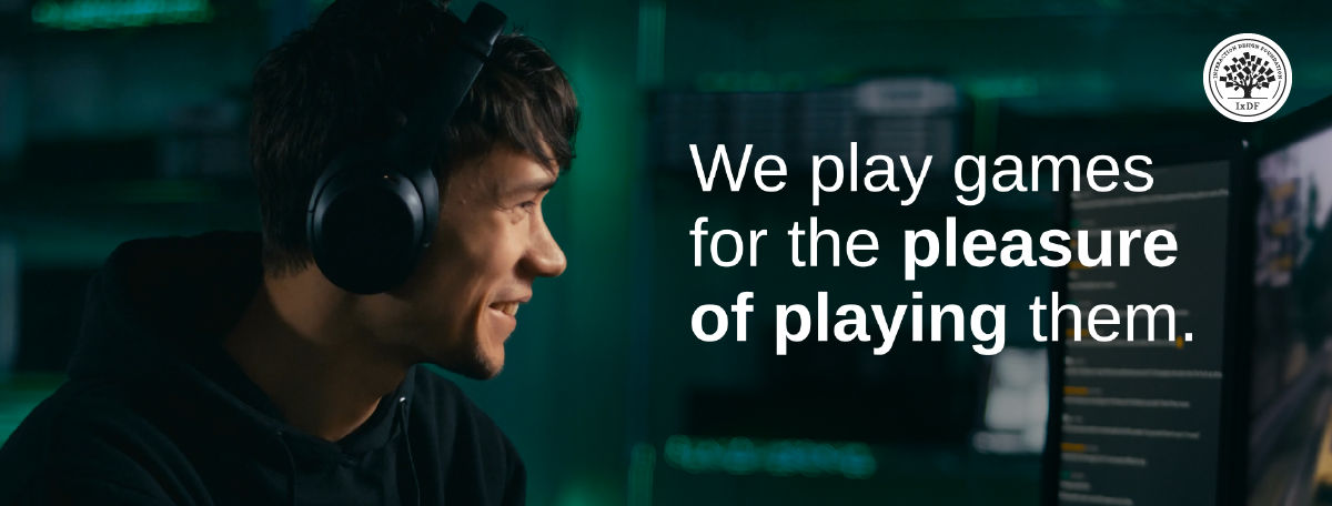 A young gamer with headphones on, visibly enjoying a gaming session, accompanied by the quote: "We play games for the pleasure of playing them."