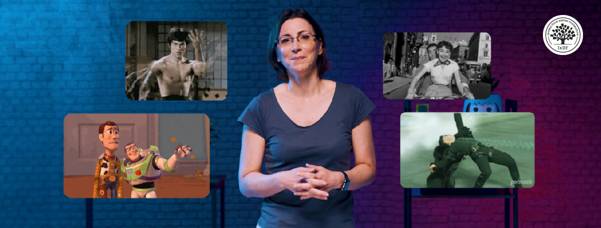 Celia Hodent stands center-frame against a blue-and-purple-lit brick wall, with four floating screens around her showing scenes from films and games she's about to reference