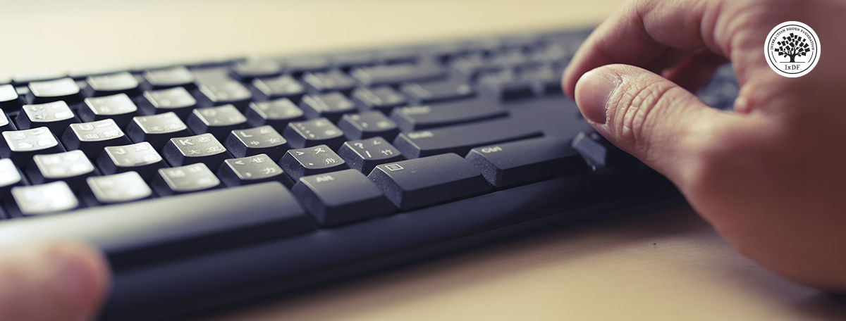 Hands using a computer keyboard in close-up