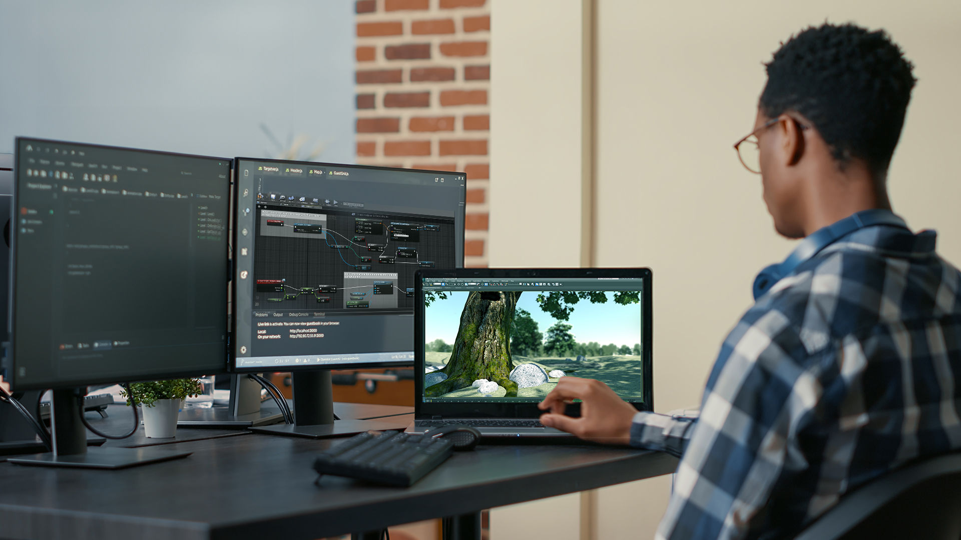 A man sitting in front of two computer monitors, designing a VR experience with VR application, Unreal Engine.