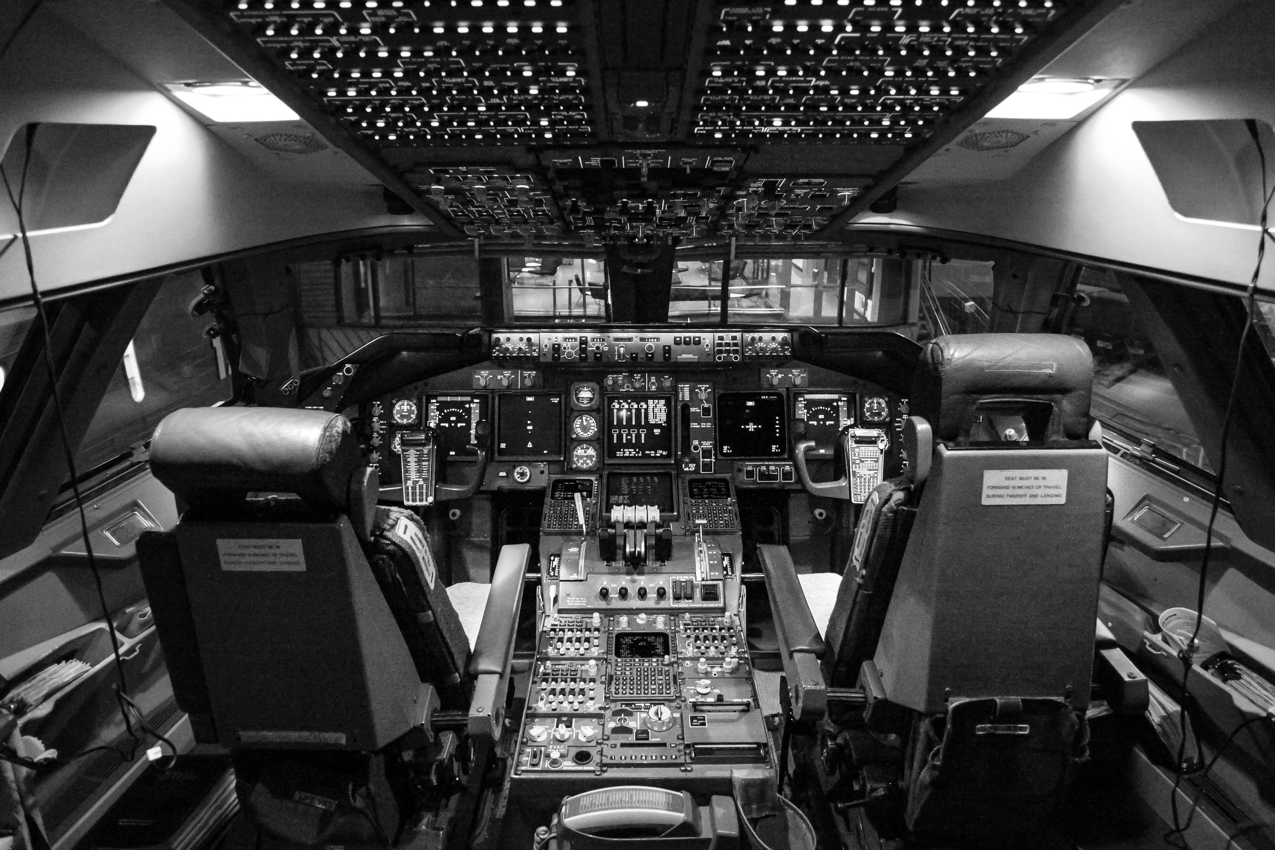 The cockpit of an aircraft, with hundreds of switches, dials and buttons.