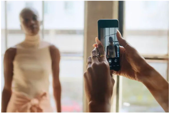 A screenshot of a camera taking a picture of a person.