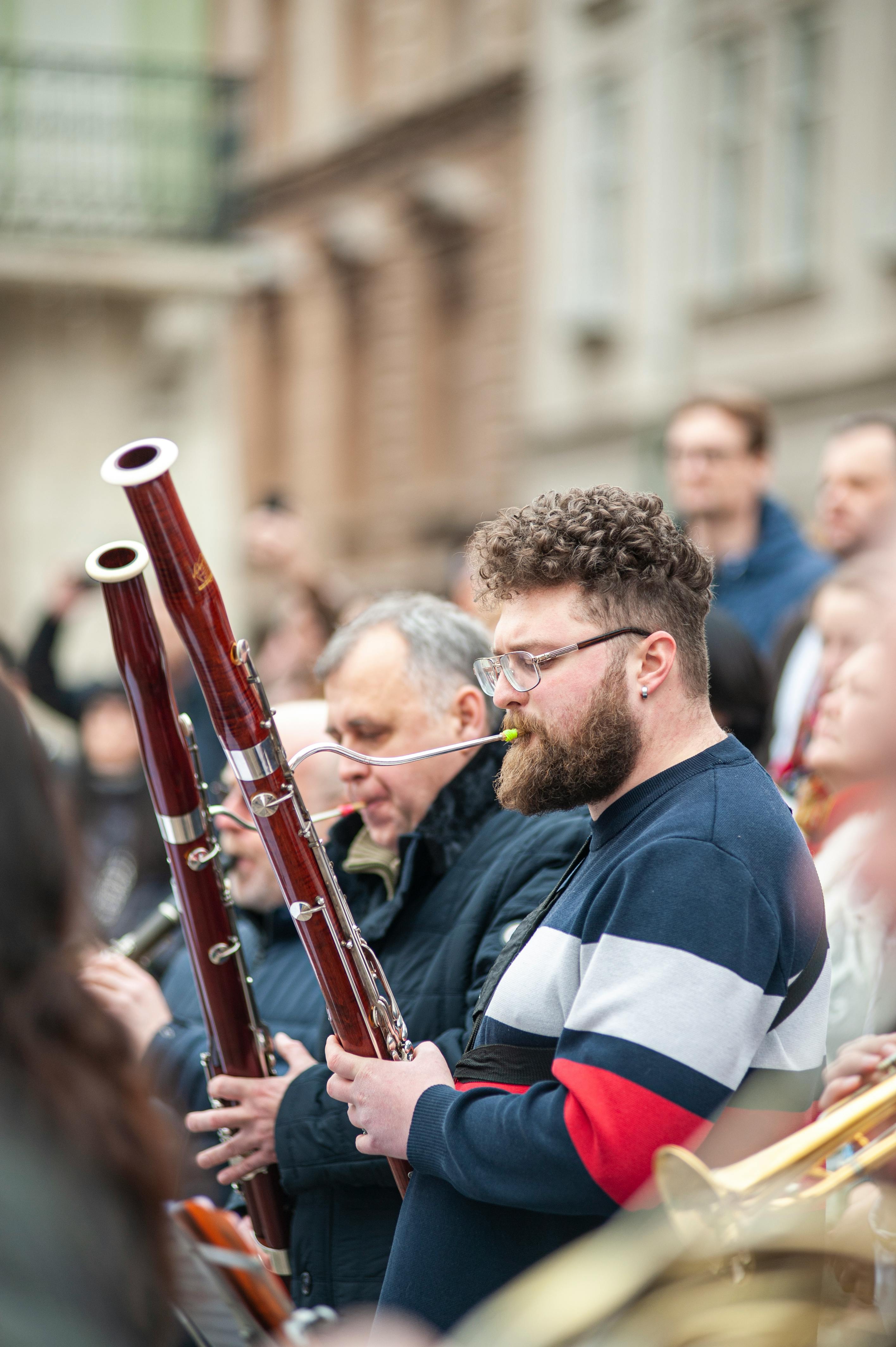Men Playing on Musical Instruments on Street