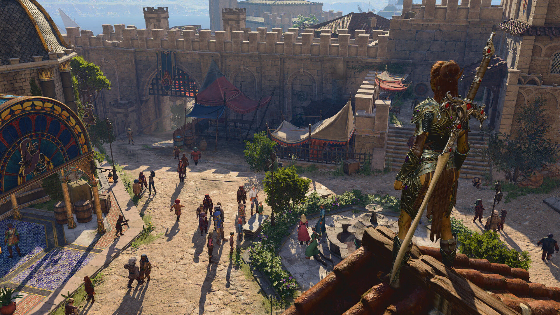 A warrior in armor with a large sword on their back standing on a roof top looking out across a castle courtyard filled with people in the game Baldur's Gate 3.