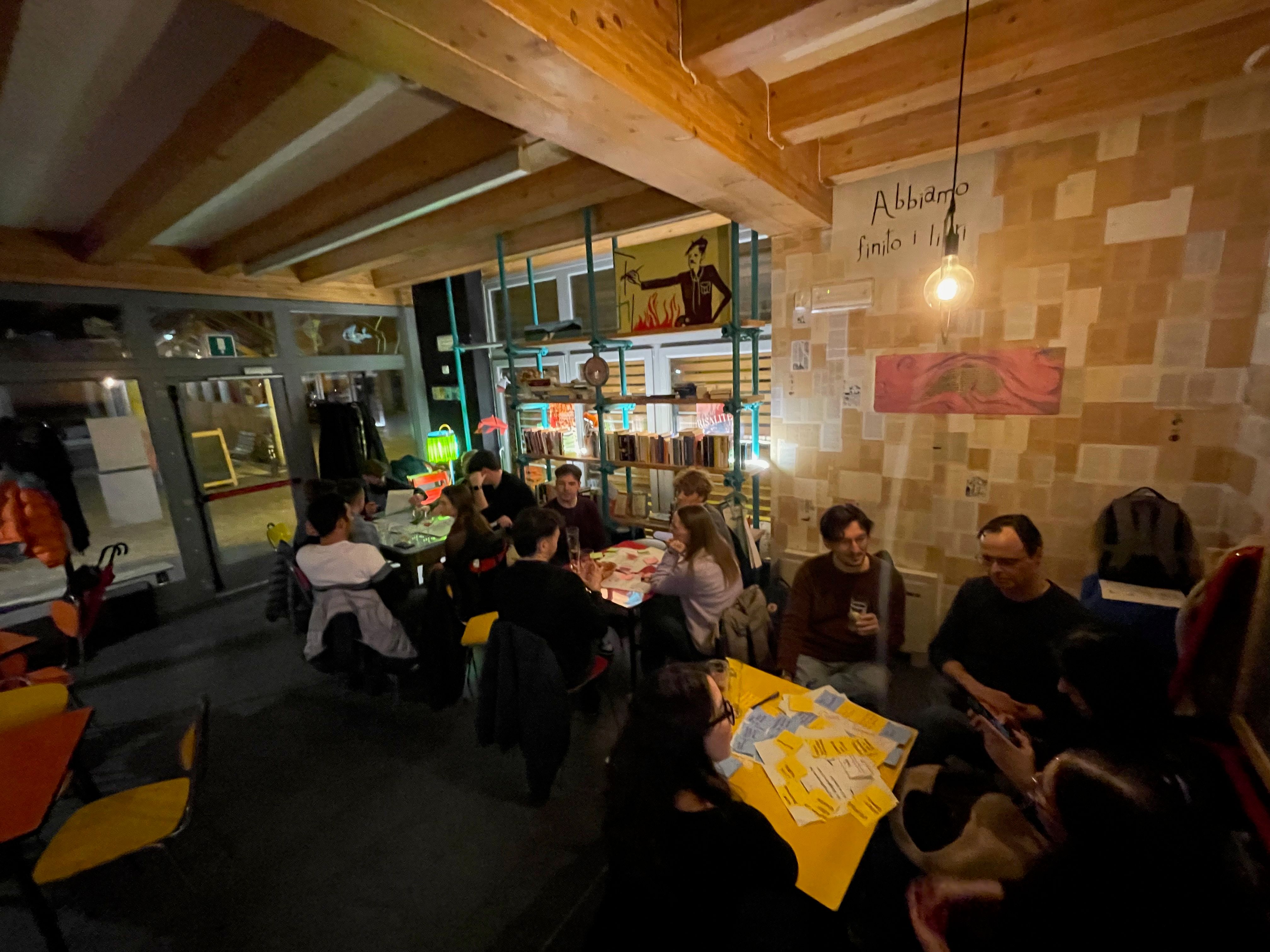 Tables filled with post-its with groups of designers