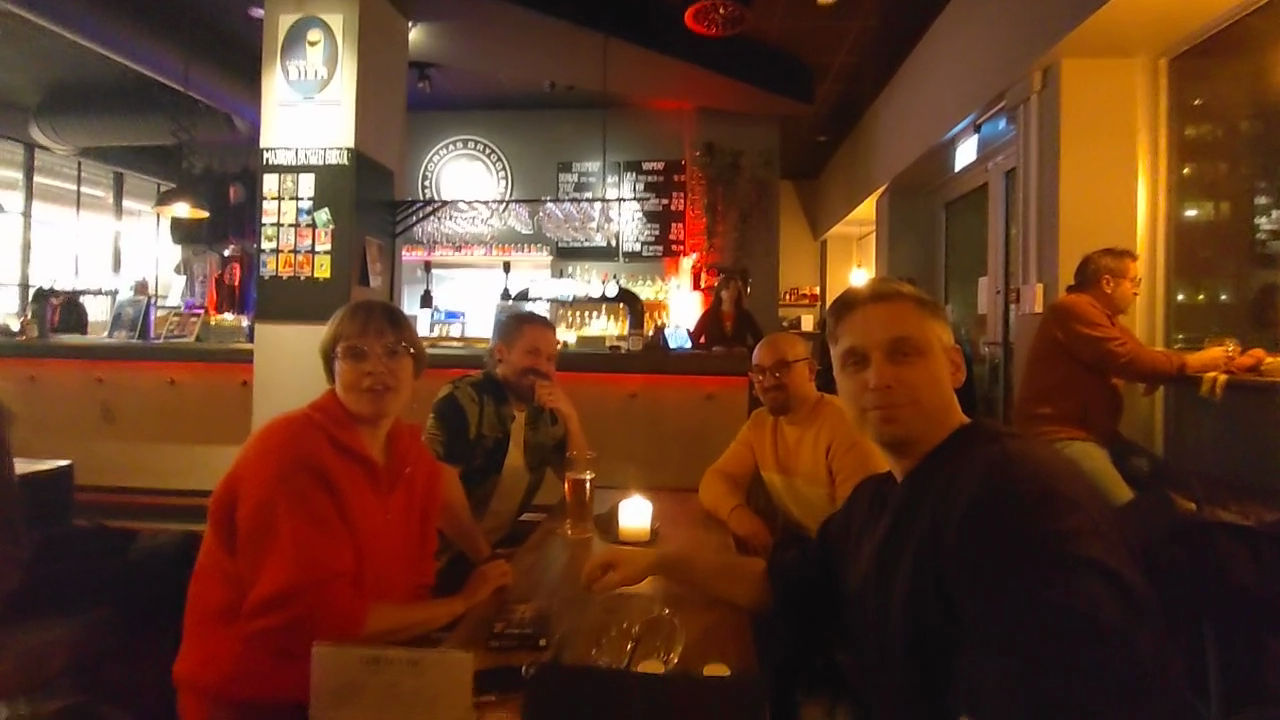 Four people around a table in a pub