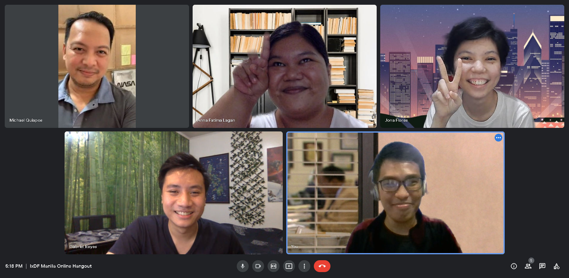 A Google Meet session with five participants.